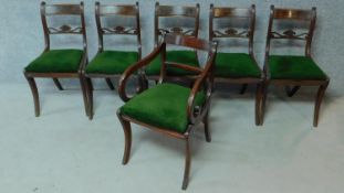 A set of five Regency mahogany dining chairs on sabre supports together with a Regency style