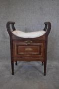 An Edwardian mahogany and satinwood crossbanded piano stool fitted with sheet music section. H.68