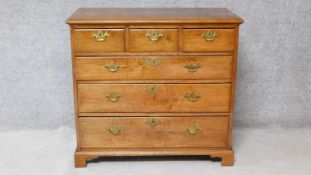 A Georgian mahogany chest of three short over three long graduated drawers on bracket feet. H.92xW.