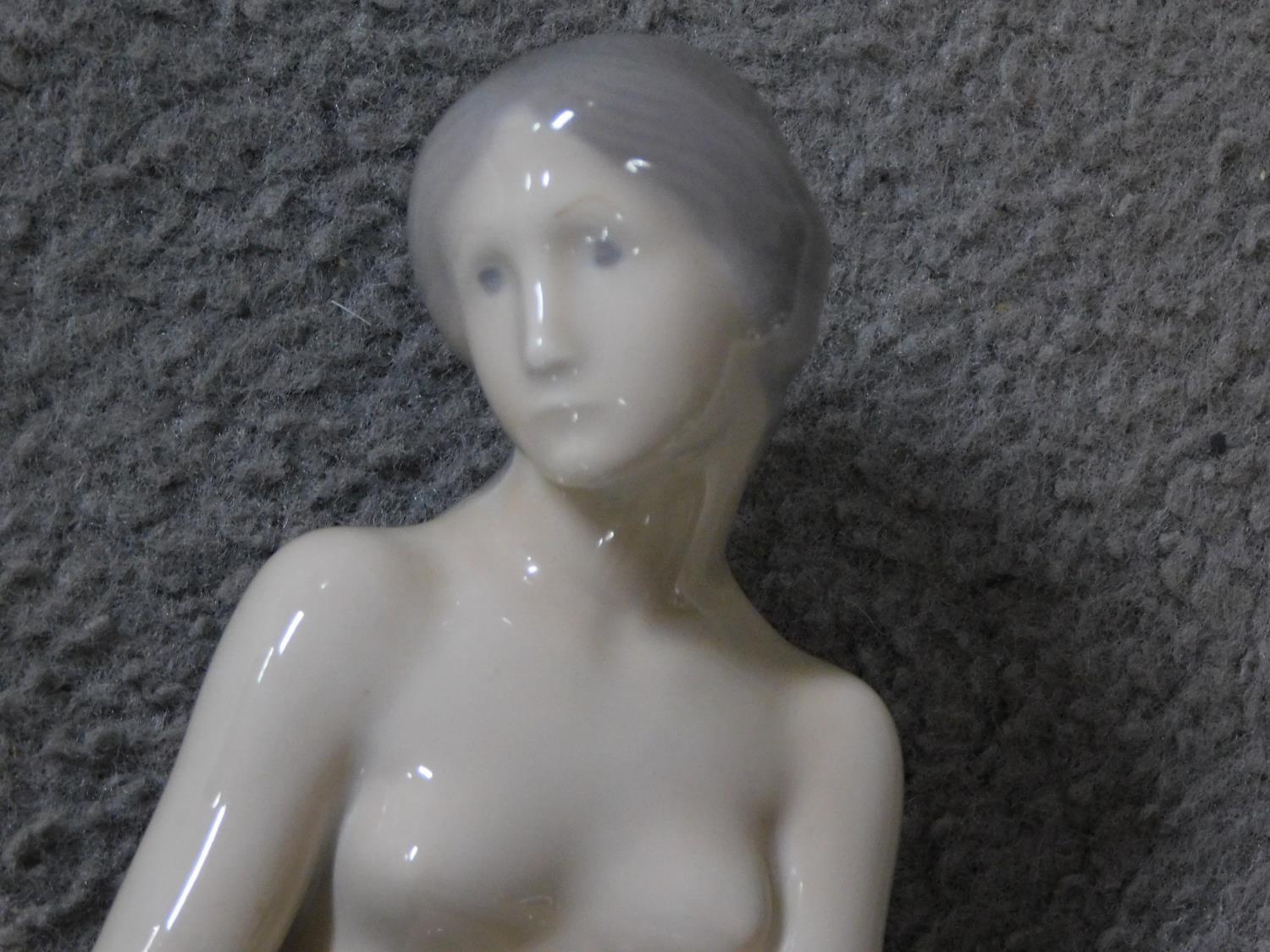 A Royal Copenhagen porcelain model of the harbour mermaid. Signed to the back. Marked to base - Image 2 of 7