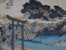 An antique coloured woodblock print from the '53 Stations of the Tokaido' series by Hiroshige.