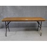 A metal framed folding trestle table H.76 L.182 W.76cm