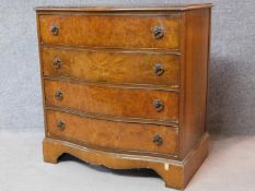 A Georgian style burr walnut chest of four long drawers on shaped bracket feet. H.82 W.79 D.50cm