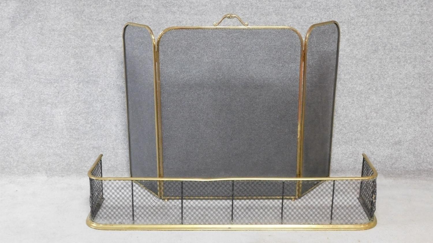 An antique brass mesh fender and brass hinged spark guard with carrying handle. H.82xW.122cm