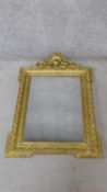 A 19th century French carved giltwood pier mirror with rococo carved shell and foliate cresting. H.