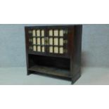 A Chinese hardwood cabinet with panel doors above open compartment. H.71 W.78 D.34cm