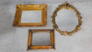 Two antique giltwood mirrors and a gilded plaster mirror. One with an oval shape with carved