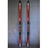A pair of Tecno Pro lightweight skis, ski sticks and carrying holdall. L.167cm