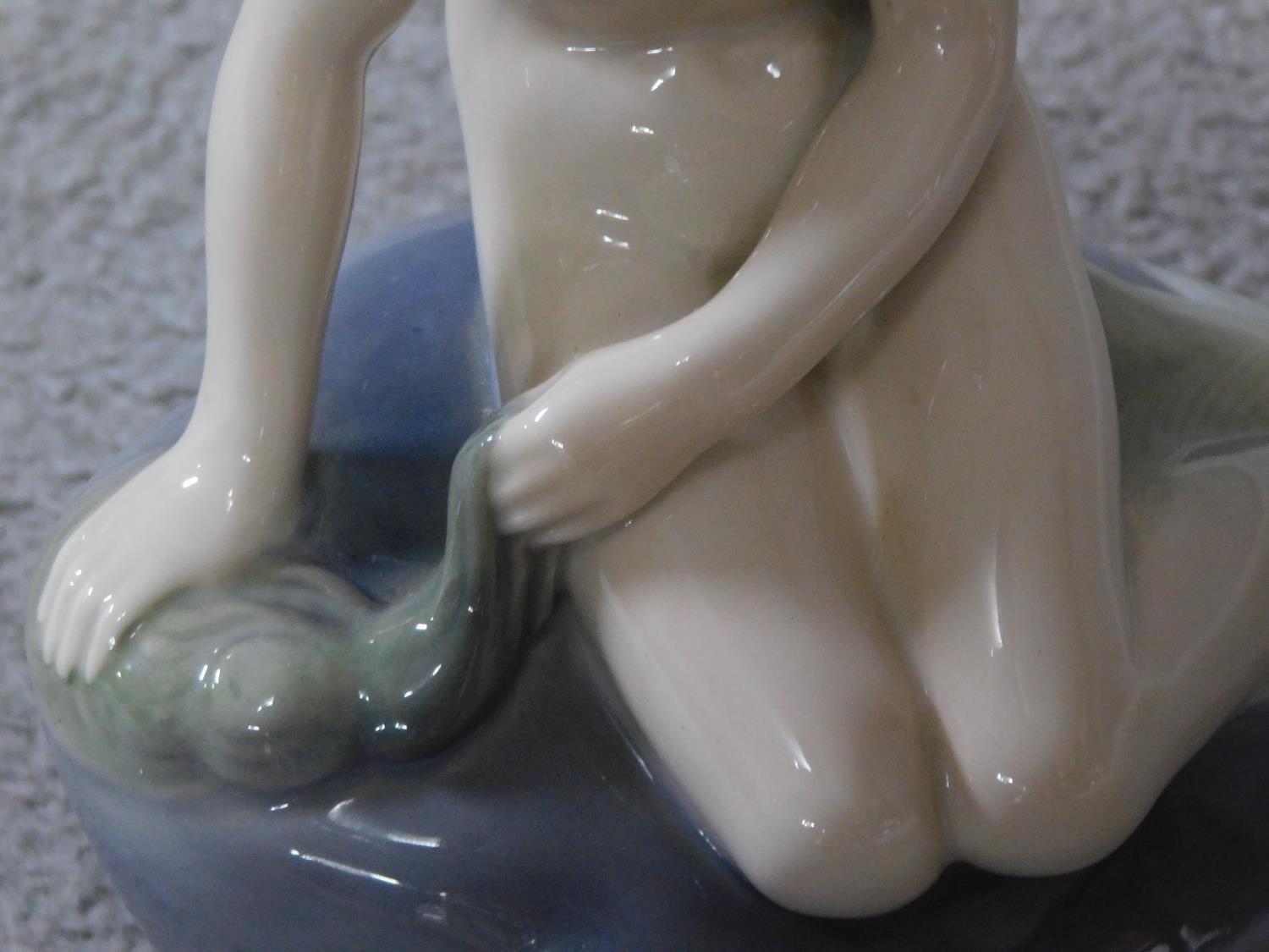 A Royal Copenhagen porcelain model of the harbour mermaid. Signed to the back. Marked to base - Image 3 of 7