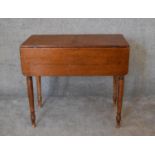 A Victorian mahogany drop flap Pembroke table on ring turned tapering supports. H.77 x 86cm (ext