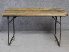 A pine topped metal framed folding trestle table. H.79 L.140 W.63cm