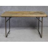 A pine topped metal framed folding trestle table. H.79 L.140 W.63cm