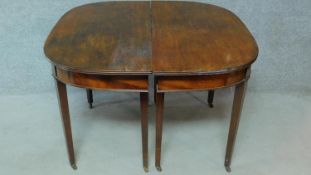 A Georgian mahogany D-end extending dining table on square tapering supports. H.76 L.181 W.55cm (