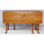 A Georgian Cuban mahogany drop flap gateleg dining table on six pad foot supports. H.70xW.119xD.