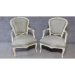 A pair of Louis XV style white painted carved frame armchairs on cabriole legs. H.97cm