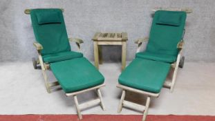 A pair of rustic teak steamer chairs together with a similar occasional table by Indian Ocean