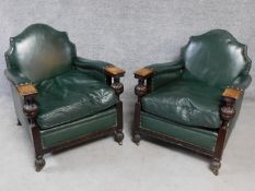 A pair of mid 20th century carved oak frame leather upholstered armchairs on bulbous reeded