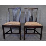 A pair of Georgian mahogany dining chairs. H.92 x 52cm (upholstery original but worn)