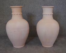 A large pair of Persian Hamadan storage pots with studded collars. H.85 x 50cm