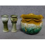 Two painted green ceramic miniature jardineres on column stands and an Art Nouveau floral design