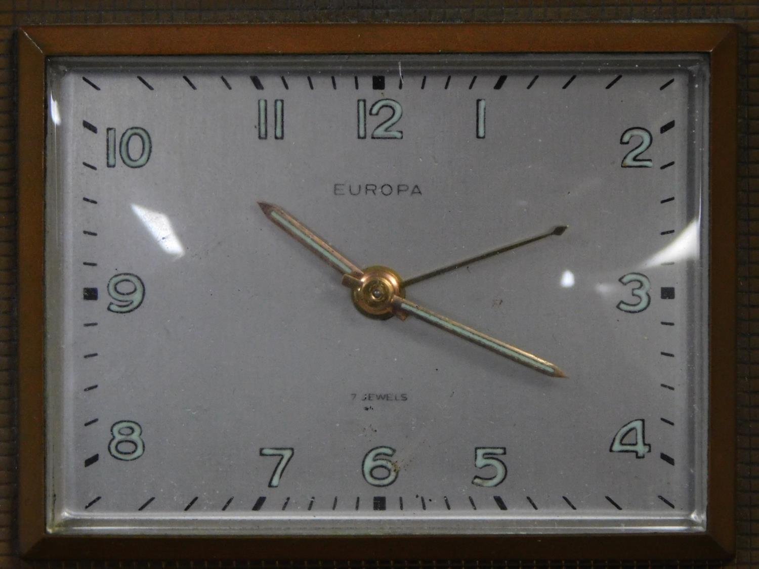 An Art Deco brass desk clock by Europa. Luminous numbers. Geometric form with linear detailing. H. - Image 2 of 3