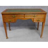 A 19th century oak writing table with leather inset top above two long frieze drawers and two