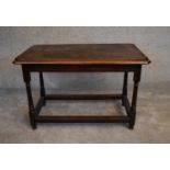 An antique oak hall or centre table on turned stretchered supports. H.76 x 112 x 63cm