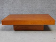 A contemporary teak rectangular coffee table on plinth base. H.38 L.140 W.90cm