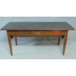 An antique oak dining table with planked lift up top and dough bin fitted to underside. H.74 W.171