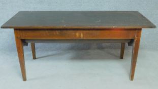An antique oak dining table with planked lift up top and dough bin fitted to underside. H.74 W.171