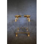 A small Empire style side table with mirrored shelves to base and glass shelves to top with clear