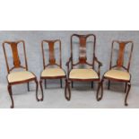 A set of four Edwardian mahogany and satinwood inlaid dining chairs carved to the back on cabriole
