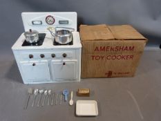 A vintage AMERSHAM TOYS 'Made in England' early 20th century tinplate toy cooker / stove / oven with