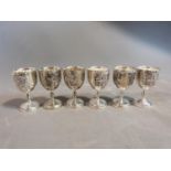 A set of six white metal silea vine design kiddush cups. H.8cm.