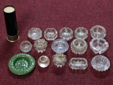 A collection of vintage ashtrays. Some cut glass and one in the form of a gun shell. Including one