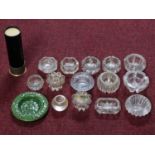 A collection of vintage ashtrays. Some cut glass and one in the form of a gun shell. Including one