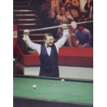 A framed and glazed signed photograph of Northern Irish world snooker champion Dennis Taylor,