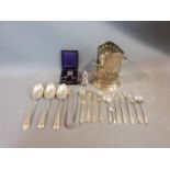 A collection of silver plate items. Including an antique razor ,a pierced two handled wine bottle