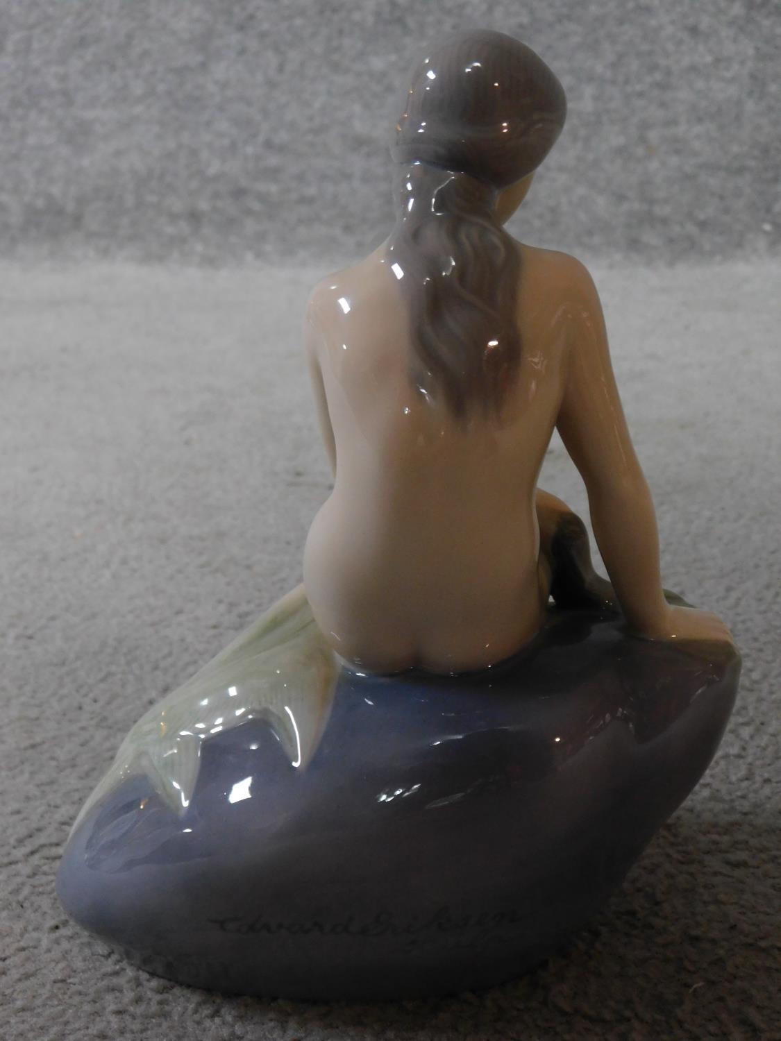 A Royal Copenhagen porcelain model of the harbour mermaid. Signed to the back. Marked to base - Image 5 of 7