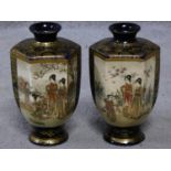 A pair of satsuma pottery Japanese vases with hand painted and gilded figures and floral design.