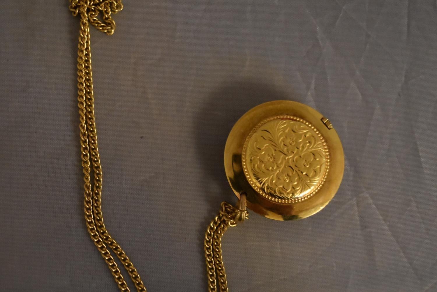 A vintage Tegrov gold tone pendant antimagnetic watch and chain. Impressed floral design to the back - Image 4 of 5