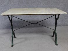 A marble topped conservatory table on wrought iron trestle style supports. H.71 L.107 W.61cm