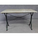 A marble topped conservatory table on wrought iron trestle style supports. H.71 L.107 W.61cm