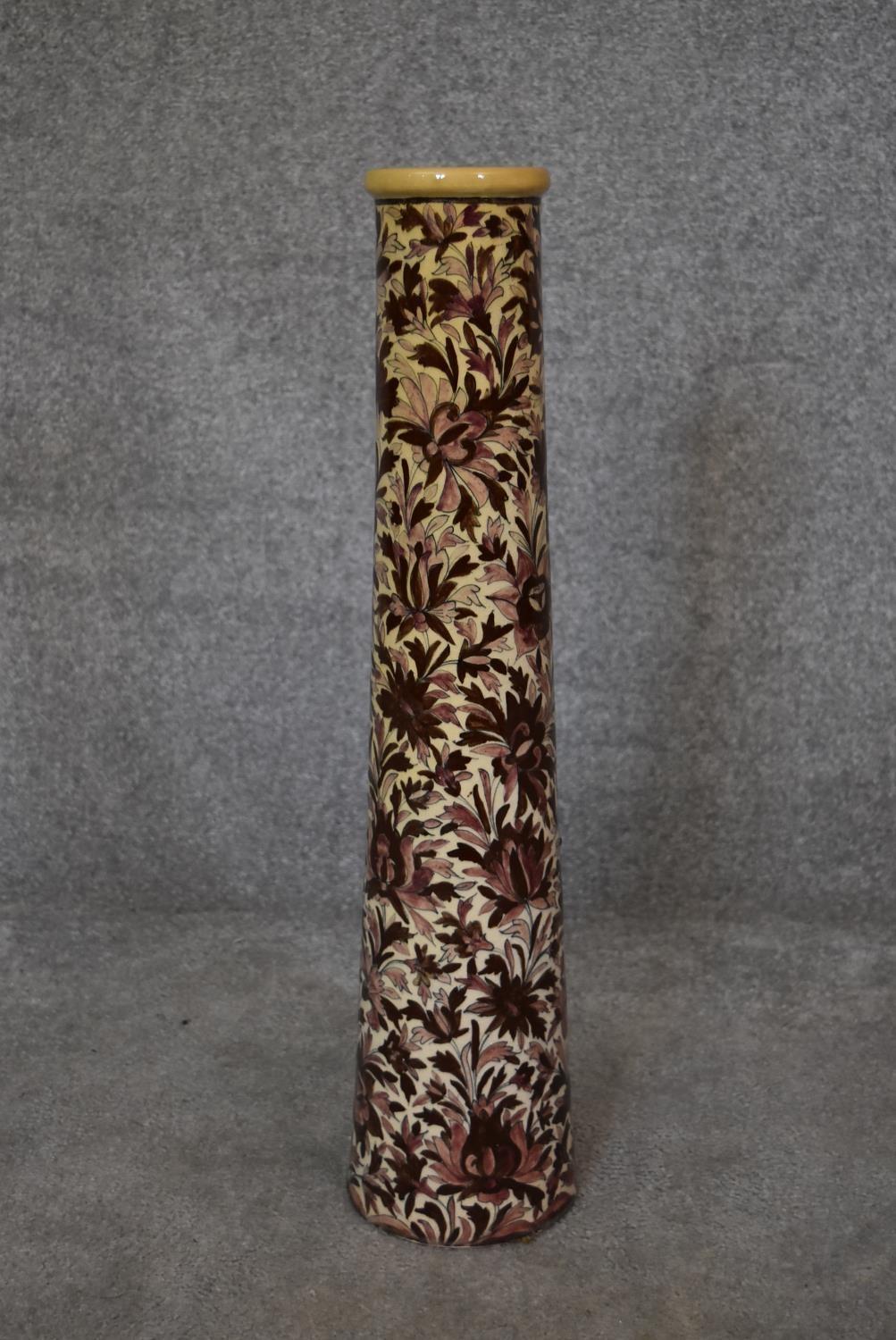 A Persian Isfahan bamboo vase, decorated with stylised flowers. H.70cm