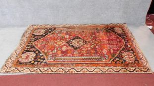 A North West Persian Zanjan style rug, central diamond medallion with repeating floral motifs on a