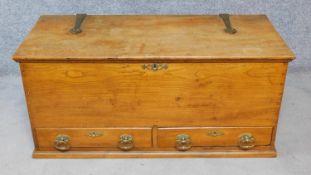 A late 19th century elm blanket box fitted with two base drawers and Arts and Crafts style brass