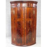 Georgian flame mahogany and mahogany crossbanded bowfronted corner cabinet with satinwood string