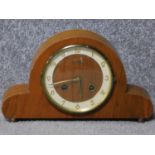 A 1930's Bentima wooden cased mantle clock. With an FHS German movement and gold tone numbers.