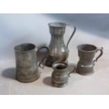 Four pewter tankards and measures, circa 1800. Glass bottomed tankard, large measures stamped AS,