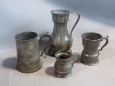 Four pewter tankards and measures, circa 1800. Glass bottomed tankard, large measures stamped AS,